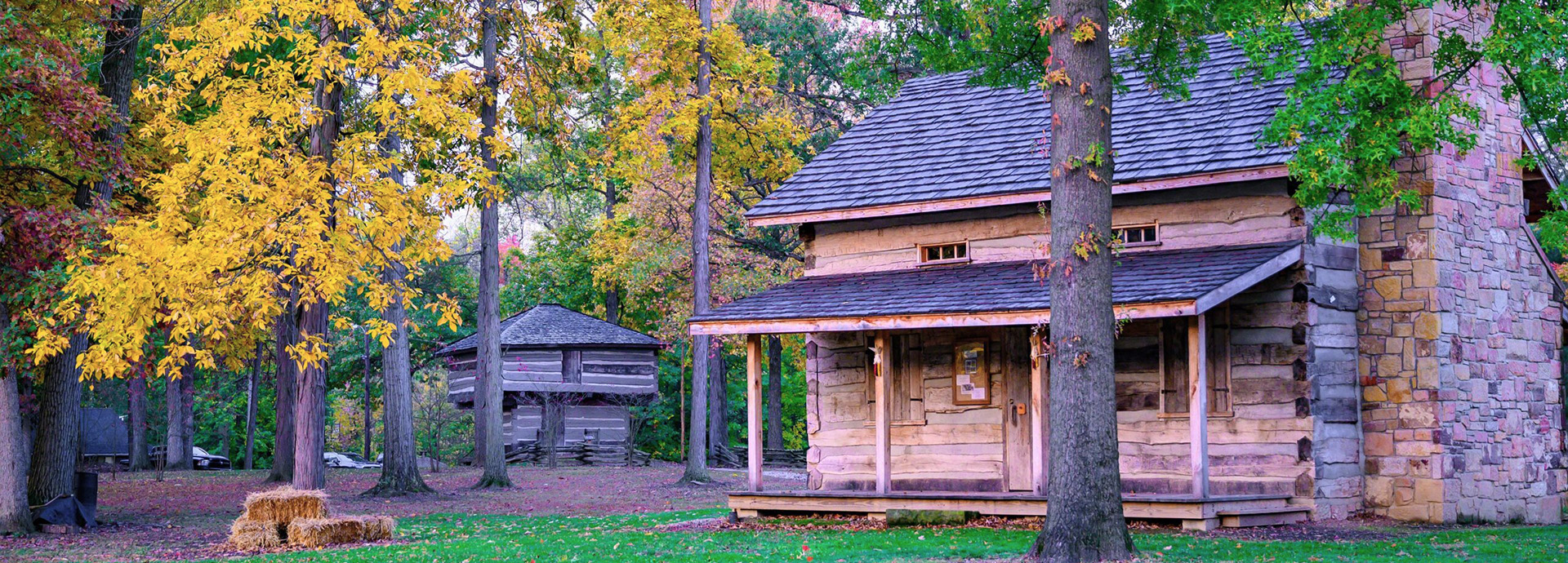 Slideshow Image - A cabin in a vibrant campground in fall